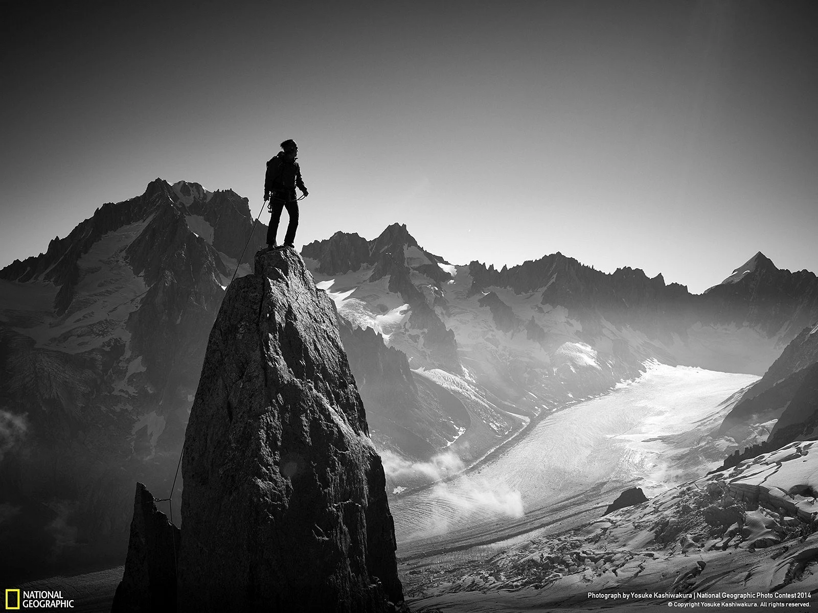 Black Man Climbing A Mountain Wallpaper