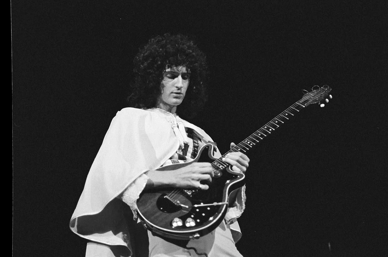 Brian May playing Guitar Wallpaper