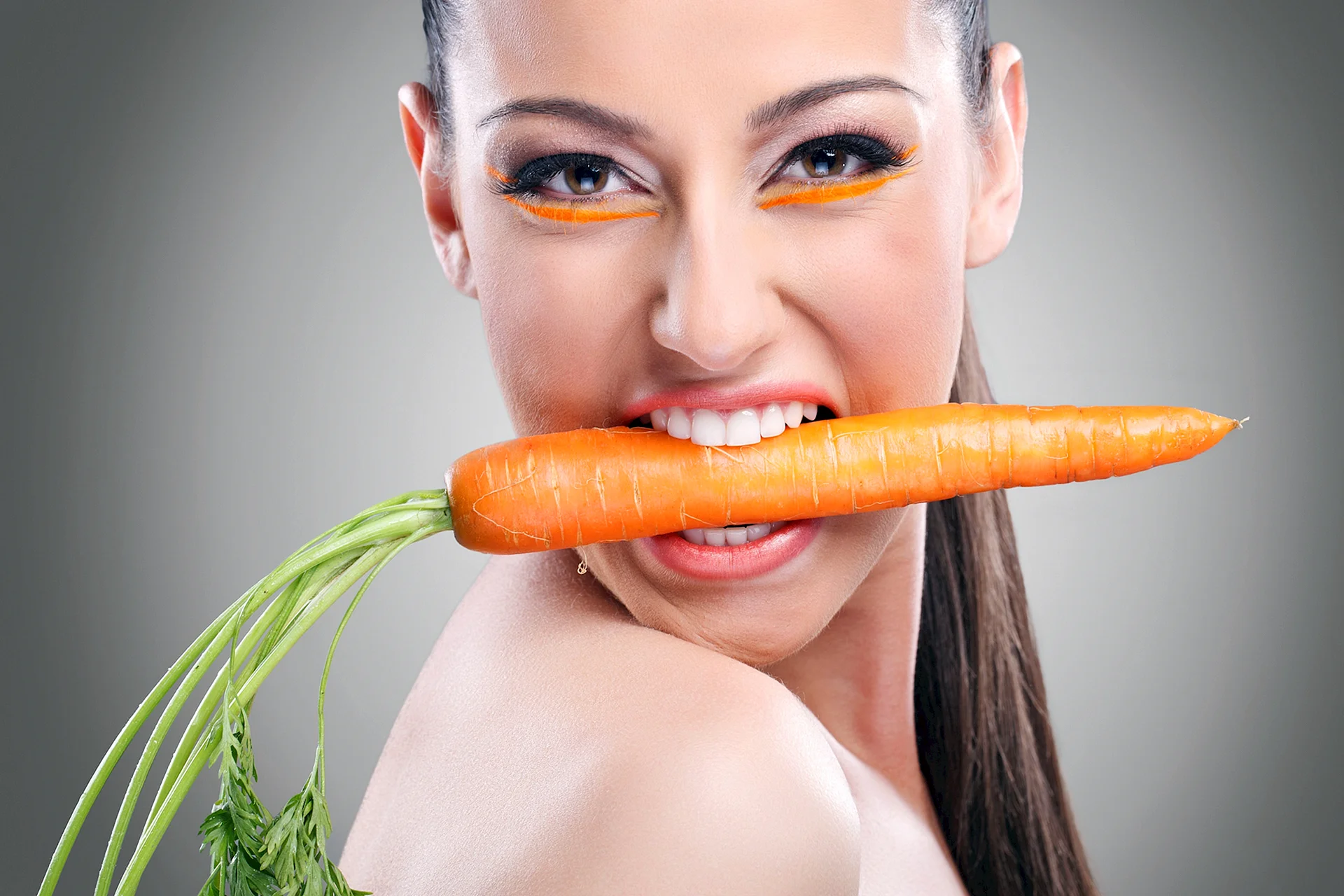 Woman eating Carrots Wallpaper